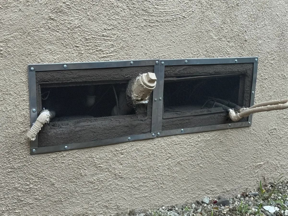 Ember-resistant mesh installed over foundation vent