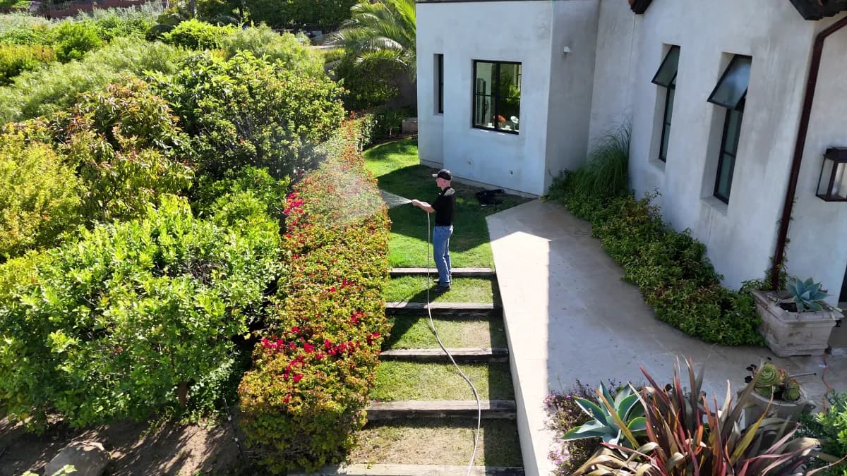 Matador Fire system in use — spraying fire retardant along property perimeter