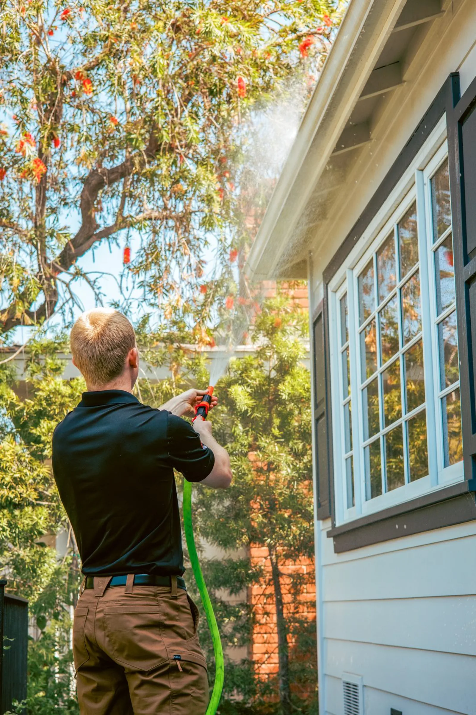 Spraying home with fire retardant